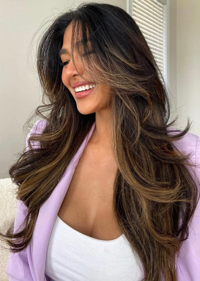 Wearing 20" Seamless Clip-Ins in <a href="https://wwwluxyhaircom/collections/seamless-clip-in-hair-extensions/products/seamless-mocha-bronde-balayage-20-180g?from=karinacabiling"> Mocha Bronde Balayage </a> image