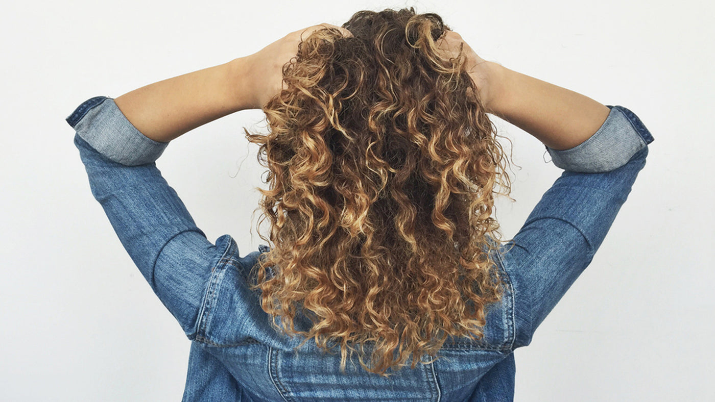 Finger comb your curly hair extensions for minimum damage.