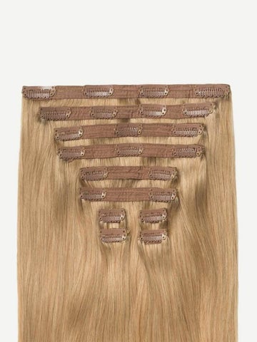 Set of blonde clip-in hair extensions arranged flat