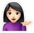 A girl emoji with black hair, and a purple shirt.